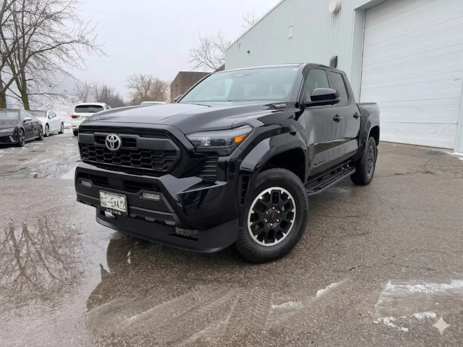 one-owner, Clean Carfax, local vehicle, non-smoker 2025 Toyota Tacoma TRD Offroad Prem Hyb in Black with Black interior – front exterior view one-owner, Clean Carfax, local vehicle, non-smoker 2025 Toyota Tacoma TRD Offroad Prem Hyb in Black with Black interior – front exterior view