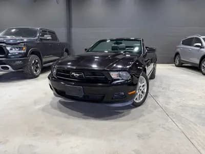 Certified, non-smoker 2012 Ford Mustang Premium 2D Convertible in Black with Burgundy interior – front exterior view