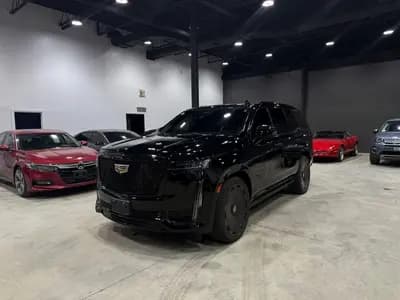 Certified, garage kept, non-smoker 2021 Cadillac Escalade Sport Platinum in Black with Brown interior, front three quarter view