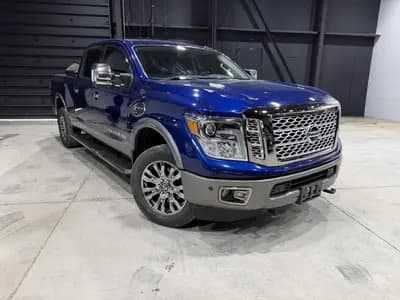 Certified 2019 Nissan Titan XD Platinum Reserve in Blue with Brown interior – front exterior view