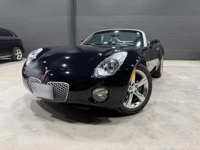 Certified, garage kept, non-smoker 2006 Pontiac Solstice 2D Convertible in Black with Black interior – front exterior view
