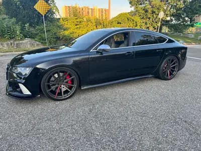 2016 Audi RS 7 Base in Black with White interior, front three quarter view