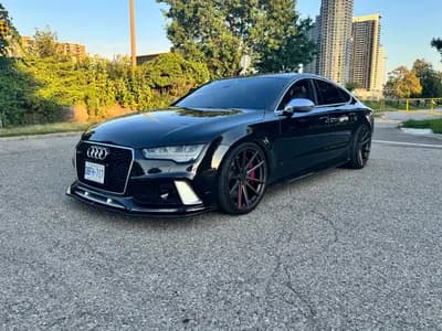 Clean Carfax, garage kept, local vehicle, non-smoker 2016 Audi RS 7 Base in Black with White interior, front three quarter view