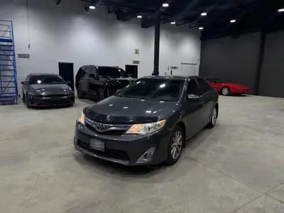 2012 Toyota Camry XLE 4D Sedan V6 in Gray with Gray interior, front three quarter view
